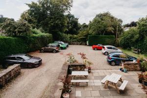 a group of parked cars parked in a driveway at Coorie Inn Restaurant and Rooms in Crieff