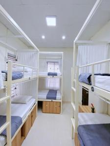 Postel nebo postele na pokoji v ubytování Amy 2 Hostel Hue