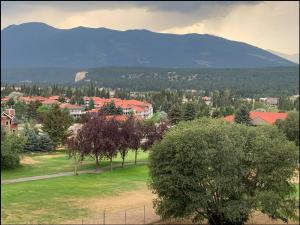 a view of a town with a mountain in the background at Mountain View Vacation Villa Main Floor Unit, No Stairs in Fairmont Hot Springs