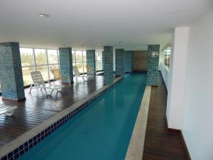 Bazén v ubytování Condomínio Sant Martin - Alto luxo com piscina, churrasqueira e academia nebo v jeho okolí