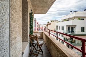 a balcony with a chair and a view at Dreams Port Cambrils Apartment in Cambrils