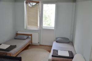 Postel nebo postele na pokoji v ubytování Center House Hostel