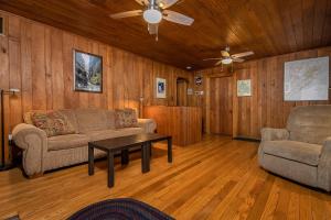 a living room with two couches and a table at Ski Shore in Swanton +43 photos