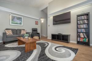 a living room with a couch and a tv at Waltzing Matilda in Swanton