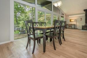 a dining room with a wooden table and chairs at Waltzing Matilda in Swanton +58 photos