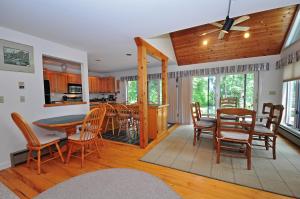 a dining room and kitchen with a table and chairs at Sunrise in Oakland