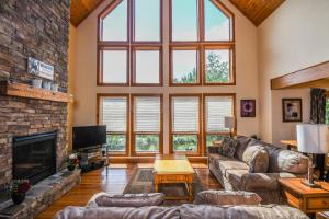 a living room with a couch and a fireplace at Mountain Top Lodge in McHenry