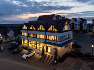 a house with a solar panel on top of it at NECKARWESTHEIMER Appartement in Neckarwestheim