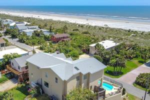 an aerial view of a house and the beach at The Sand Castle Heated Pool Atlantic Ocean in St. Augustine
