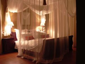 Tempat tidur dalam kamar di Plumbago Guest House