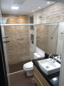 a bathroom with a shower and a toilet and a sink at Apartamento Top Expo Center Norte Paulista Centro in Sao Paulo