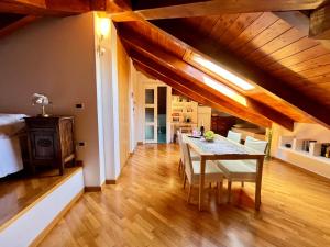 a kitchen and dining room with a table and chairs at Paradise - nature and wellness in Pino Torinese