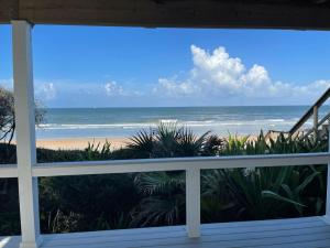 a view of the beach from a balcony at Serenity One 100 percent Oceanfront 6 Bedrooms in Ponte Vedra Beach