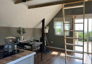 a kitchen with a spiral staircase in a room at Unique Stay - Eco Country A-Frame Cabin in Cabanes