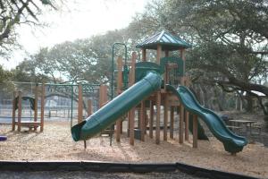 a playground with a slide in a park at Casa Blanca Casita by the Ocean in St. Augustine