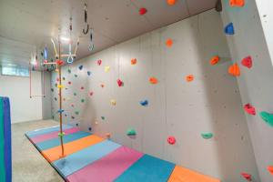 a climbing wall in a gym with a rock wall at Scenic Drive Resort in Muskegon