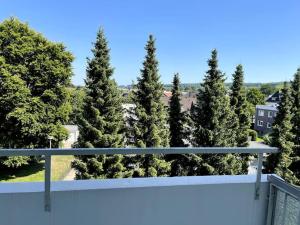 a view from the balcony of a house with trees at Elpke in Bielefeld