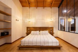 Ένα ή περισσότερα κρεβάτια σε δωμάτιο στο Casas Jaguar