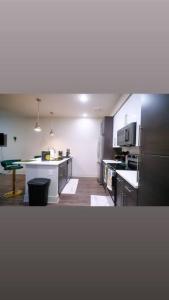 a large kitchen with a counter in the middle at COZY 1 bed/1 bath in Atlanta
