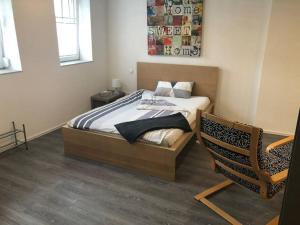 Postel nebo postele na pokoji v ubytování Modernes 1-Zimmer-Apartment im Herzen Oberkochens