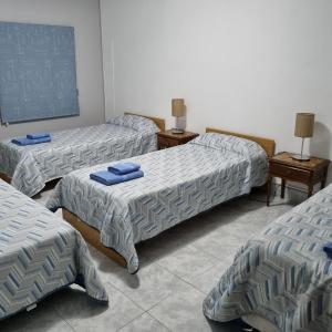 מיטה או מיטות בחדר ב-La Posada del Turista