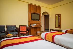 Letto o letti in una camera di Hotel Crown Himalayas