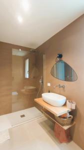 a bathroom with a sink and a mirror at Casa di Pino in Cefalù