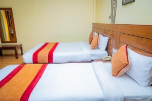 Letto o letti in una camera di Hotel Crown Himalayas