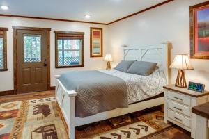 a bedroom with a bed and a dresser and two lamps at Hot Tub and Mtn Views Epic Stateline Escape! in Stateline