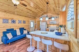 a kitchen and living room with a blue couch at Mammoth Cave Cabin Rentals 4 in Cub Run +21 photos