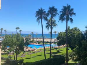 The swimming pool at or close to Playamar Primera linea front beach