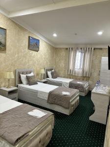 Ένα ή περισσότερα κρεβάτια σε δωμάτιο στο SEMURG HOTEL +69 φωτογραφίες