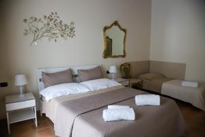 A bed or beds in a room at Villa Carmen
