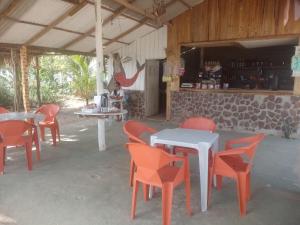 a group of tables and chairs in a building at recanto rios Belém in Mosqueiro +13 photos