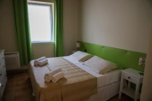 A bed or beds in a room at Villa Carmen