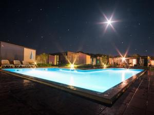 a large swimming pool at night with a starry sky at Modern chalet with 2 bathrooms and a veranda 16km from Umag in Novigrad Istria