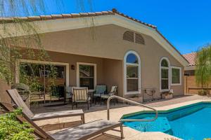a home with a swimming pool and a house at Serenity Haven with Private Pool in Gilbert in Queen Creek