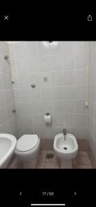 a bathroom with a toilet and a bidet at NaCity Holiday Home in Naples