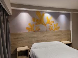 Postel nebo postele na pokoji v ubytování Hotel Alun Nehuen