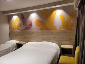 Postel nebo postele na pokoji v ubytování Hotel Alun Nehuen