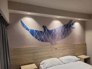 Postel nebo postele na pokoji v ubytování Hotel Alun Nehuen