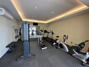 a gym with several exercise bikes and treadmills at Flats Iate Plaza in Fortaleza