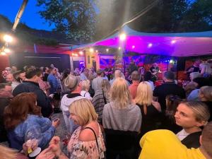 a crowd of people standing in a crowd at a party at Bungalow in Keynsham in Keynsham