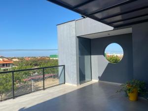 a balcony with a view of the ocean at Euro Flat Hotel in Parnaíba