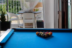 a pool table with balls on top of it at 4Ever Palace - Design & Nature in Alcácer do Sal