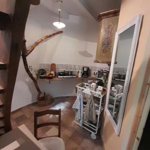 a kitchen with a table and a mirror and a shelf at Rapunzel trifft Dornröschen in Schweizermühle