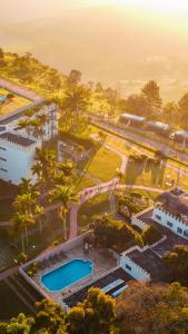 an overhead view of a park with two swimming pools at SR Boutique Hotel in São Pedro