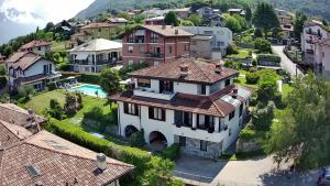 an aerial view of a house in a village at Villa Quattro Stagioni in Colico