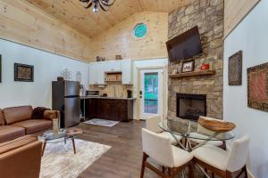a living room with a couch and a fireplace at Blue Ridge Mountainside Cottage with Fire Pit! in Epworth