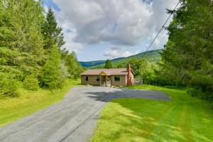 an empty road to a small house in the woods at Quiet Catskills Getaway with Deck-Panoramic Mtn Views in New Kingston